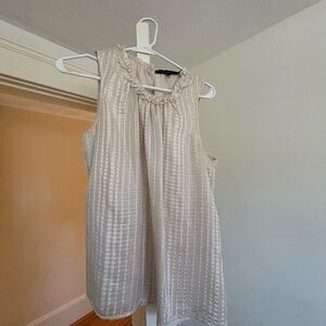 Sparkly blouse with silver threads.